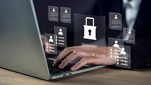 Management confidentiality and employee verification concept with businessman using laptop, reviewing secure digital documents and protected user data in a confidential business system interface.